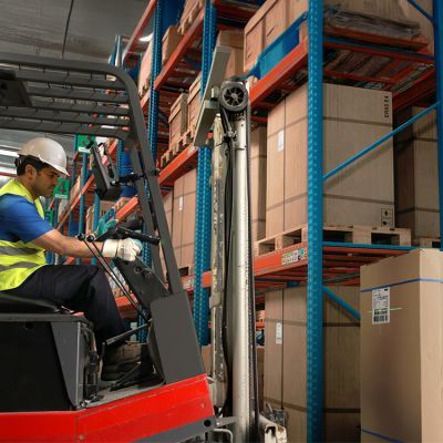Forklift driver scans SSCC code on cardboard box